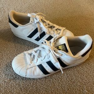 Adidas superstar with black stripes